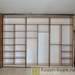 Built-in wardrobe in the living room along the entire wall photo inside