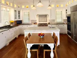 Island in the kitchen photo with dining area