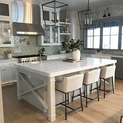 Island in the kitchen photo with dining area