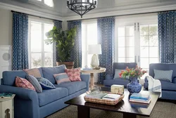 Blue Sofa And Blue Curtains In The Living Room Interior