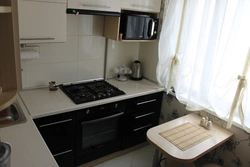 Interior in a Khrushchev-era kitchen 6 sq m design with a refrigerator