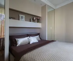 Interior of a small bedroom with one bed