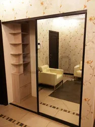 Built-In Wardrobe In The Hallway With One Mirror Photo