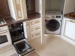 In The Kitchen There Is A Washing Machine And Dishwasher Photo