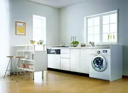 In The Kitchen There Is A Washing Machine And Dishwasher Photo