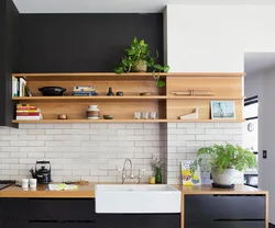 Photo of a kitchen with shelves and cabinets on the wall