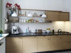 Photo Of A Kitchen With Shelves And Cabinets On The Wall