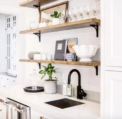 Photo of a kitchen with shelves and cabinets on the wall