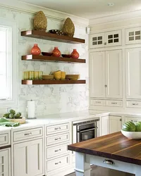 Photo of a kitchen with shelves and cabinets on the wall