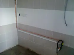 Pipes in the wall in the kitchen photo