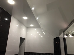 Bathtub with black suspended ceiling photo