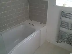 Bathroom design wall along the bathtub