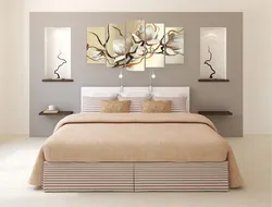 Paintings above the headboard in the bedroom photo