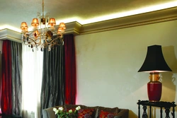 Cornices for ceilings in the living room interior