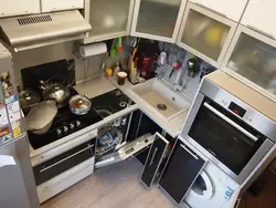 Corner Kitchen With Refrigerator And Gas Stove Photo