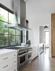 Kitchen interior stove by the window