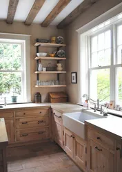 Window design in the kitchen in a wooden house