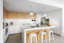 White kitchens up to the ceiling with wood photo