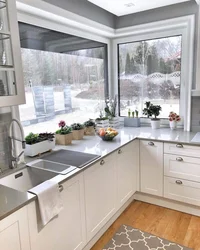 Design of a small kitchen in a house with a window