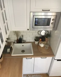 Small kitchen with machine and refrigerator design