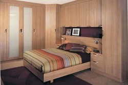 Bedroom design with large wardrobe and bed