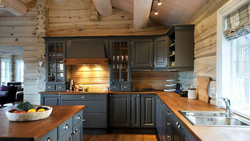 Kitchen design in a house made of rounded logs