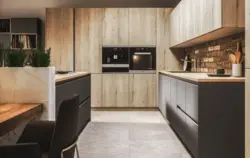 Gray kitchen with wooden facades interior