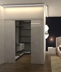Dressing room design in a bedroom 15 sq.m.