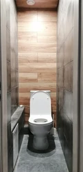 Toilet in apartment finished with laminate photo