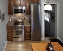 Refrigerator in the corner of the kitchen design photo