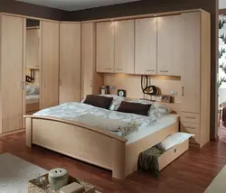 Bedrooms with corner wardrobe design and bed