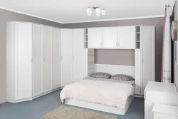 Bedrooms with corner wardrobe design and bed