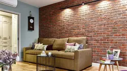 Wallpaper and decorative brick in the living room interior photo