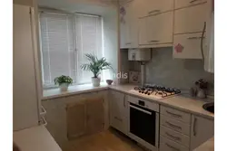 Kitchen in a five-story building with a refrigerator photo