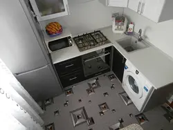 Kitchen in a five-story building with a refrigerator photo