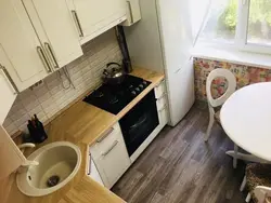 Kitchen in a five-story building with a refrigerator photo