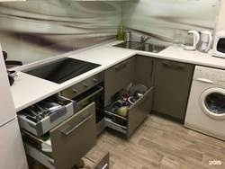 Photo of a kitchen with a dishwasher and washing machine photo