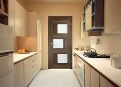 Kitchen interior with door to room