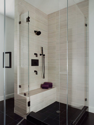 Bathtub and shower without tray in one room design