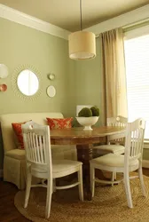 Photo of a kitchen with a round table against the wall