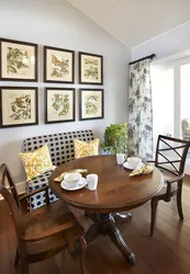 Photo of a kitchen with a round table against the wall