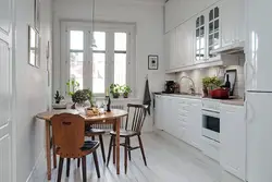 Photo Of A Kitchen With A Round Table Against The Wall