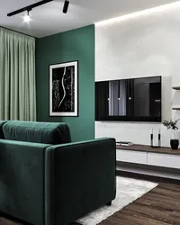 Emerald color in the interior of the kitchen living room
