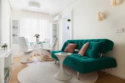 Emerald color in the interior of the kitchen living room