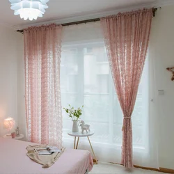 One curtain on the window in the bedroom with tulle photo