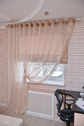 One Curtain On The Window In The Bedroom With Tulle Photo