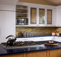 Photo of a kitchen with colored glass