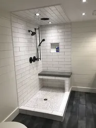 Shower tray made of tiles in the bathroom photo