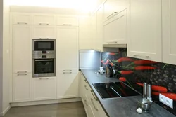 Photo of a corner kitchen with cabinets on only one wall