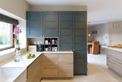 Photo of a corner kitchen with cabinets on only one wall